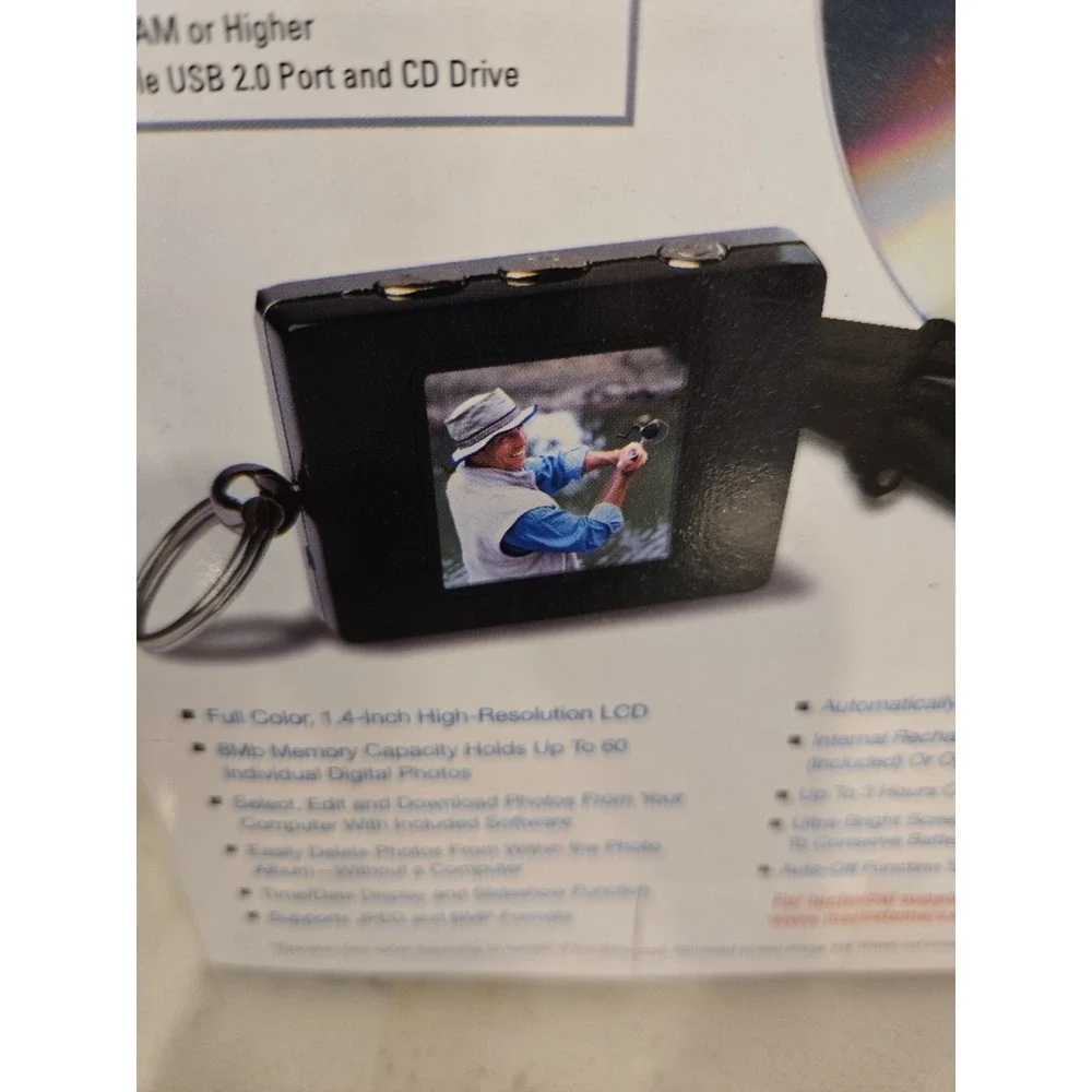 The Sharper Image Rechargeable USB 2.0 Digital Keychain Photo Album 1.4